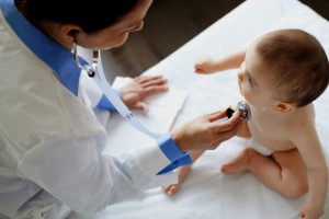 Doctor examining baby.