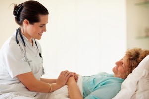 Female doctor visiting a senior patient